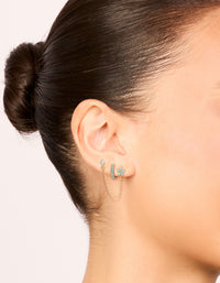 Featuring gold light blue cubic zirconia chain flower and huggie earrings pack on ear view - link has visual effect only