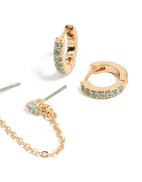 Designed with floral chain and light blue cubic zirconia crystal huggie earrings in gold close up view - link has visual effect only