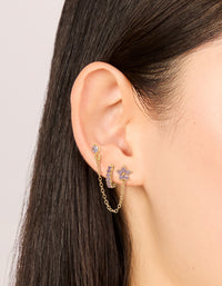 Featuring dainty cubic zirconia chain flower and huggie earrings pack with crystal in gold and stud closure on ear view - link has visual effect only