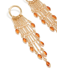 Featuring statement style gold ring with long amber diamante chain drop earrings, tassel, charm orange details close up view - link has visual effect only