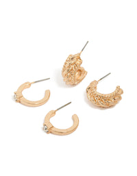 Featuring gold cable and diamante huggie earrings in a 2-pack set with huggie closure front view - link has visual effect only