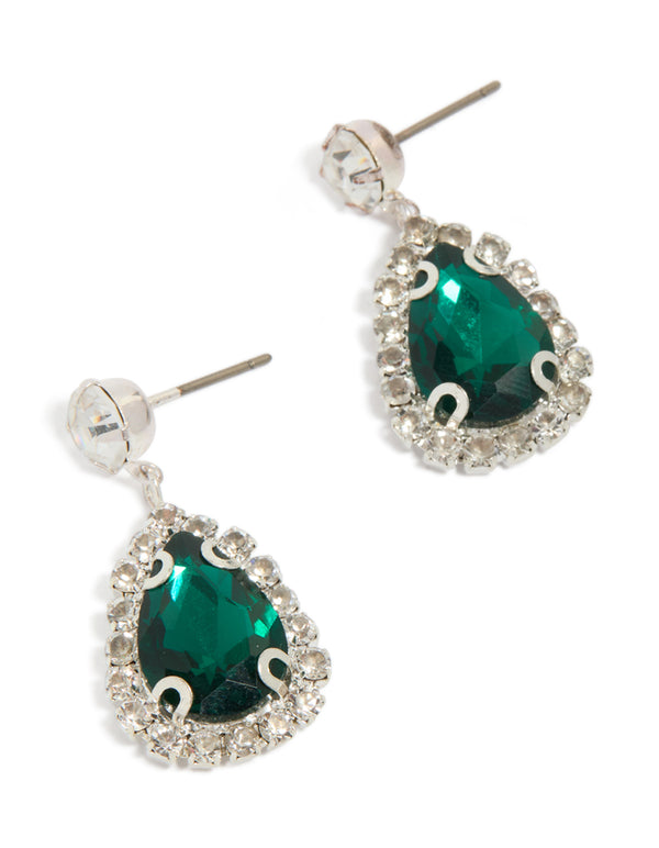 Showcasing teardrop shaped statement drop earrings in silver with diamante outline and green gemstone front view