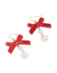 Elegant gold metallic red bow and pearl drop earrings featuring white accents front view - link has visual effect only