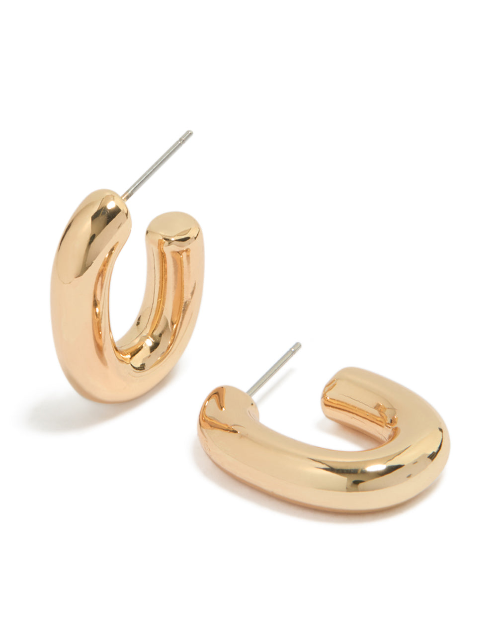 Showcasing gold oval huggie earrings with huggie closure front view