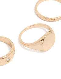 Crafted from gold featuring celestial star details and signet styling in a 3-pack close up view - link has visual effect only