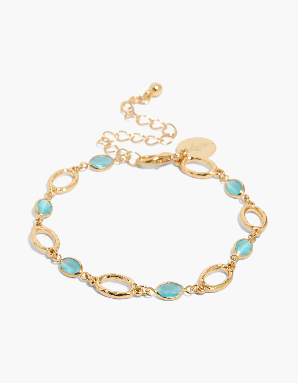 Showcasing a gold plated bracelet with blue cubic zirconia stones in oval, featuring crystal accents and turquoise color front view