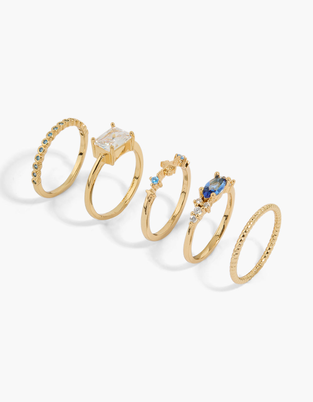 Showcasing a gold plated multicoloured cubic zirconia baguette oval star ring 5-pack featuring celestial design with crystal stones in solitaire cut front view