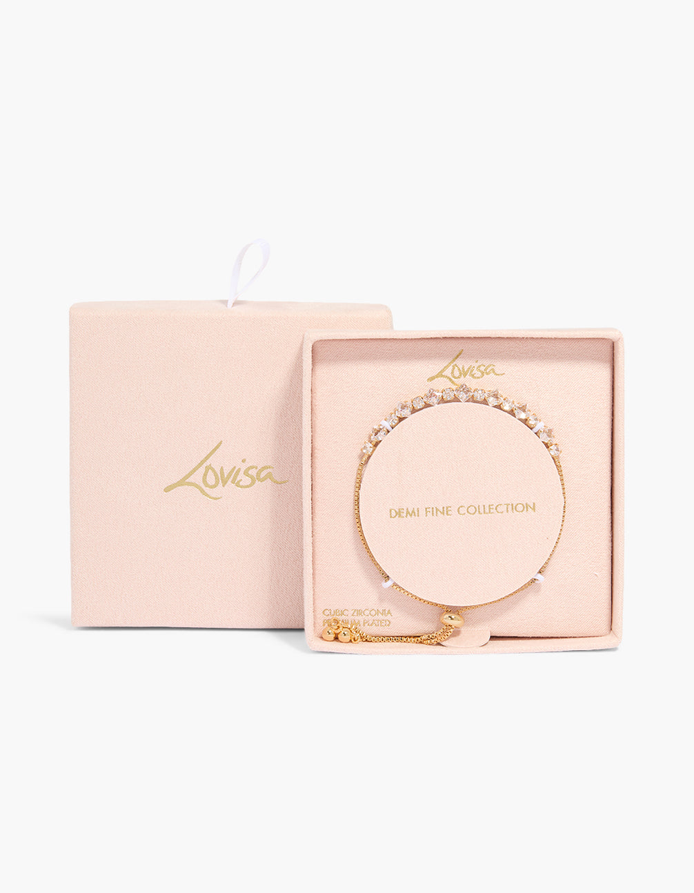 Beautifully crafted Gold Plated Multi-Shaped Cubic Zirconias Toggle Bracelet in a packaging close up view